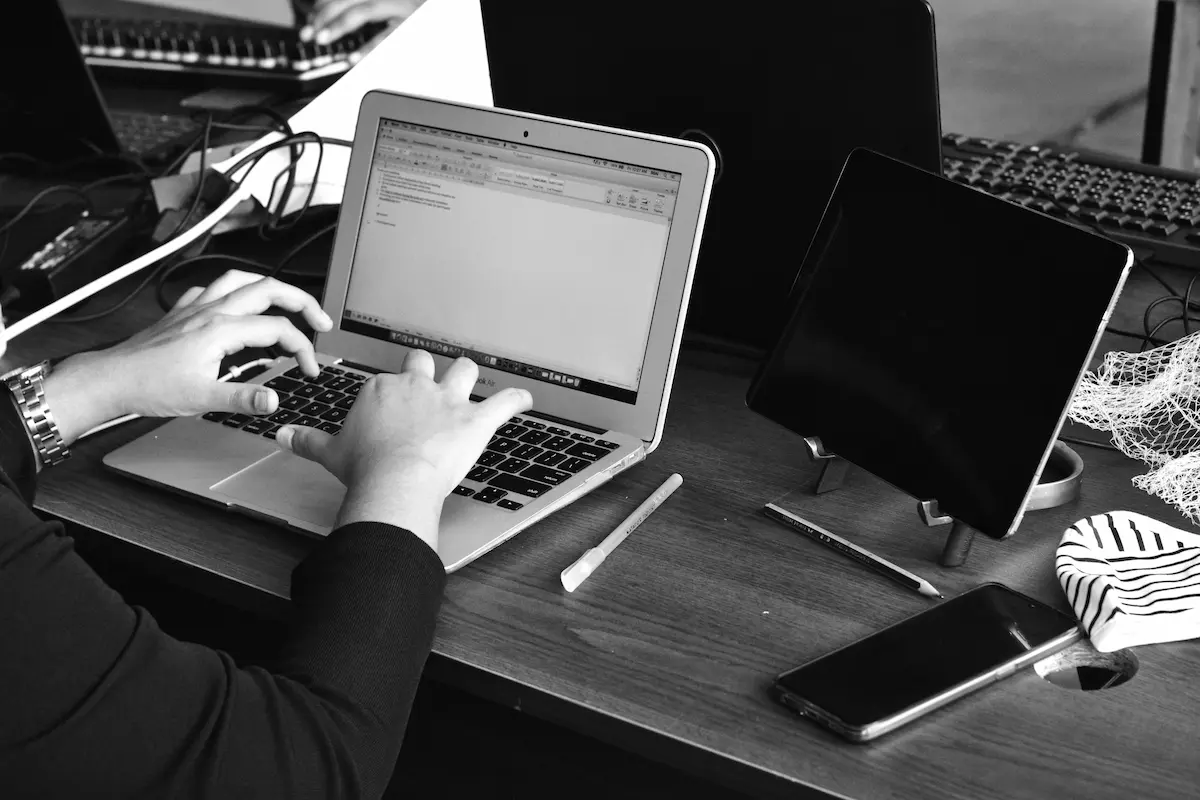 Person typing on laptop at desk
